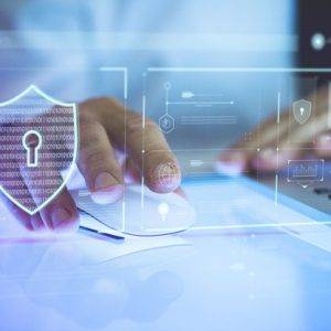 Business person logging in to his laptop